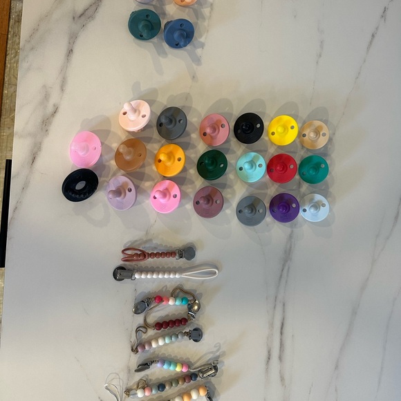 Ryan and Rose Cutie pats, Cutie clips, a teether, and some Itzy ritzy mixed in! - Picture 3 of 5